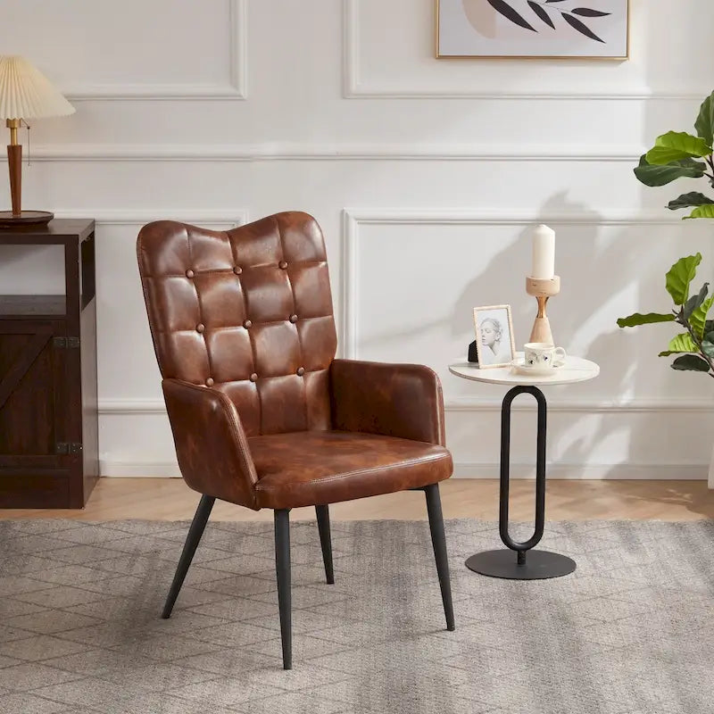 Fauteuil d'appoint à dossier haut, dossier capitonné et accoudoirs ailés