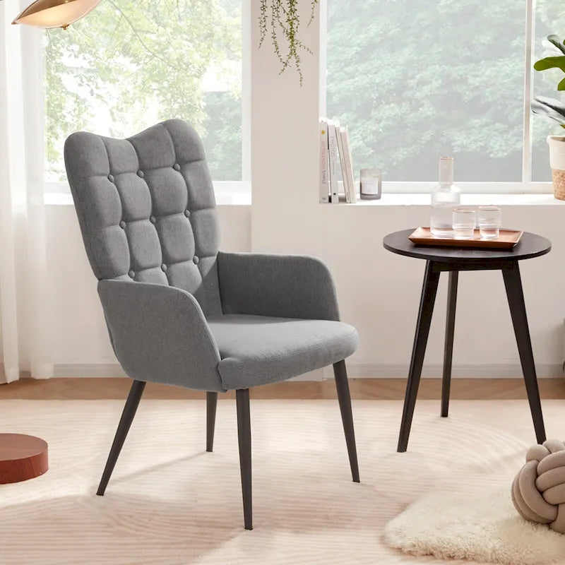 Fauteuil d'appoint à dossier haut, dossier capitonné et accoudoirs ailés
