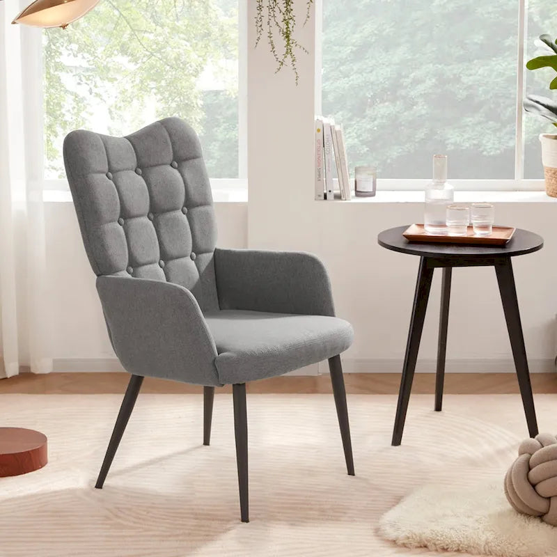 Fauteuil d'appoint à dossier haut, dossier capitonné et accoudoirs ailés