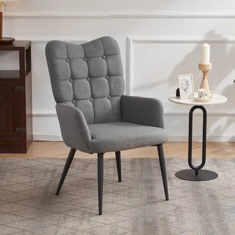 Fauteuil d'appoint à dossier haut, dossier capitonné et accoudoirs ailés