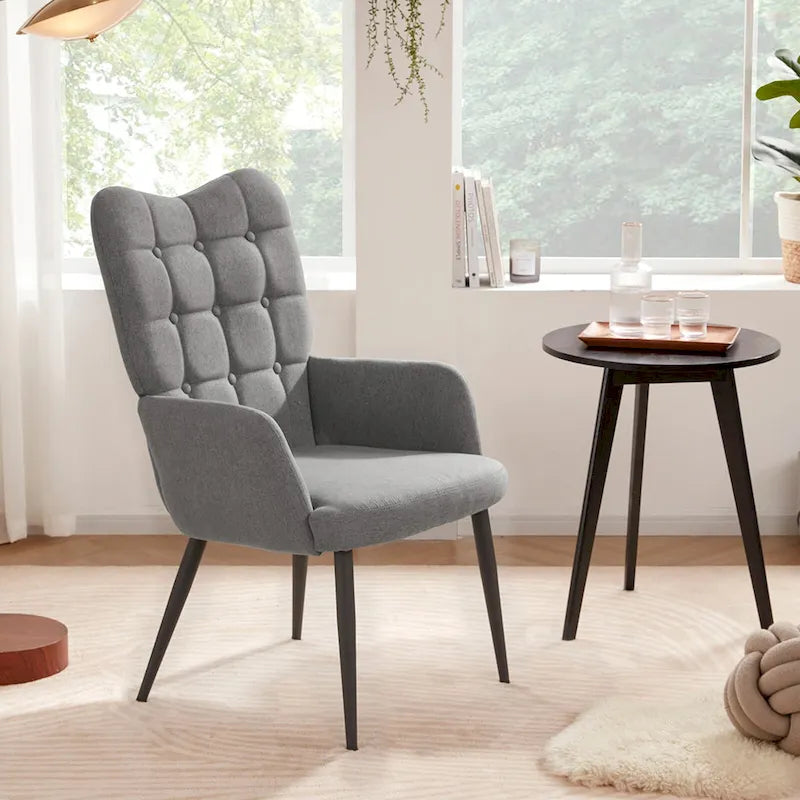 Fauteuil d'appoint à dossier haut, dossier capitonné et accoudoirs ailés