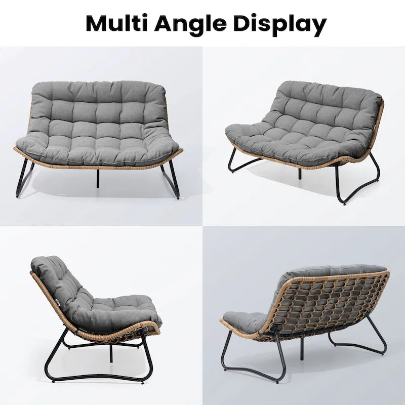 Ce fauteuil double en rotin est livré avec un coussin et convient aussi bien à une utilisation intérieure qu'extérieure.